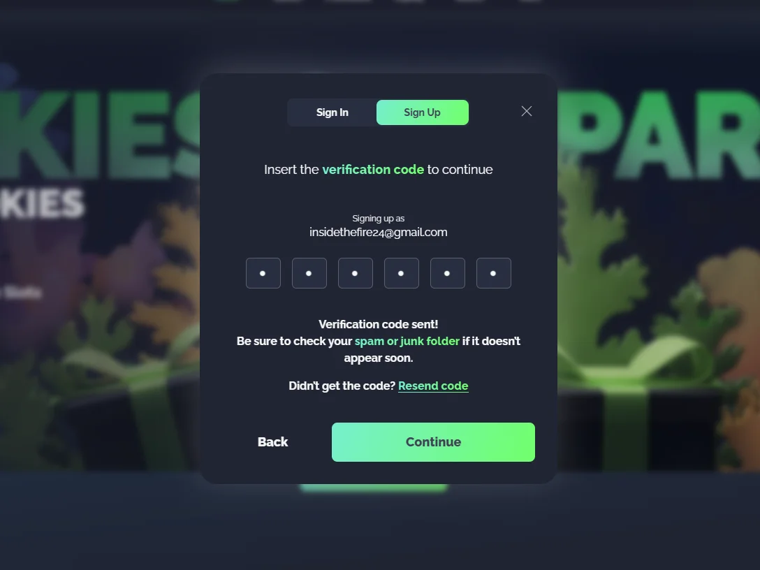 Six-digit code entry screen with resend option and spam folder reminder for email verification